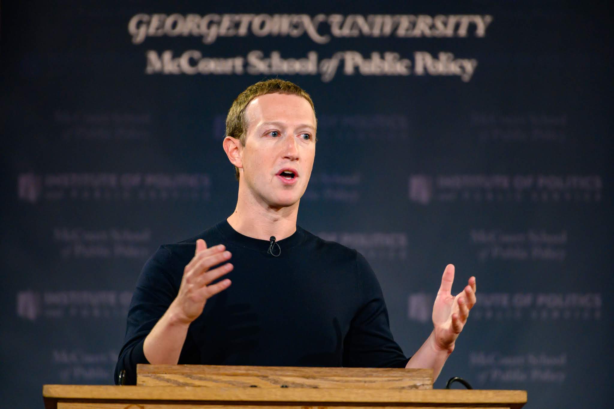 Mark Zuckerberg at podium giving a talk in Gaston Hall