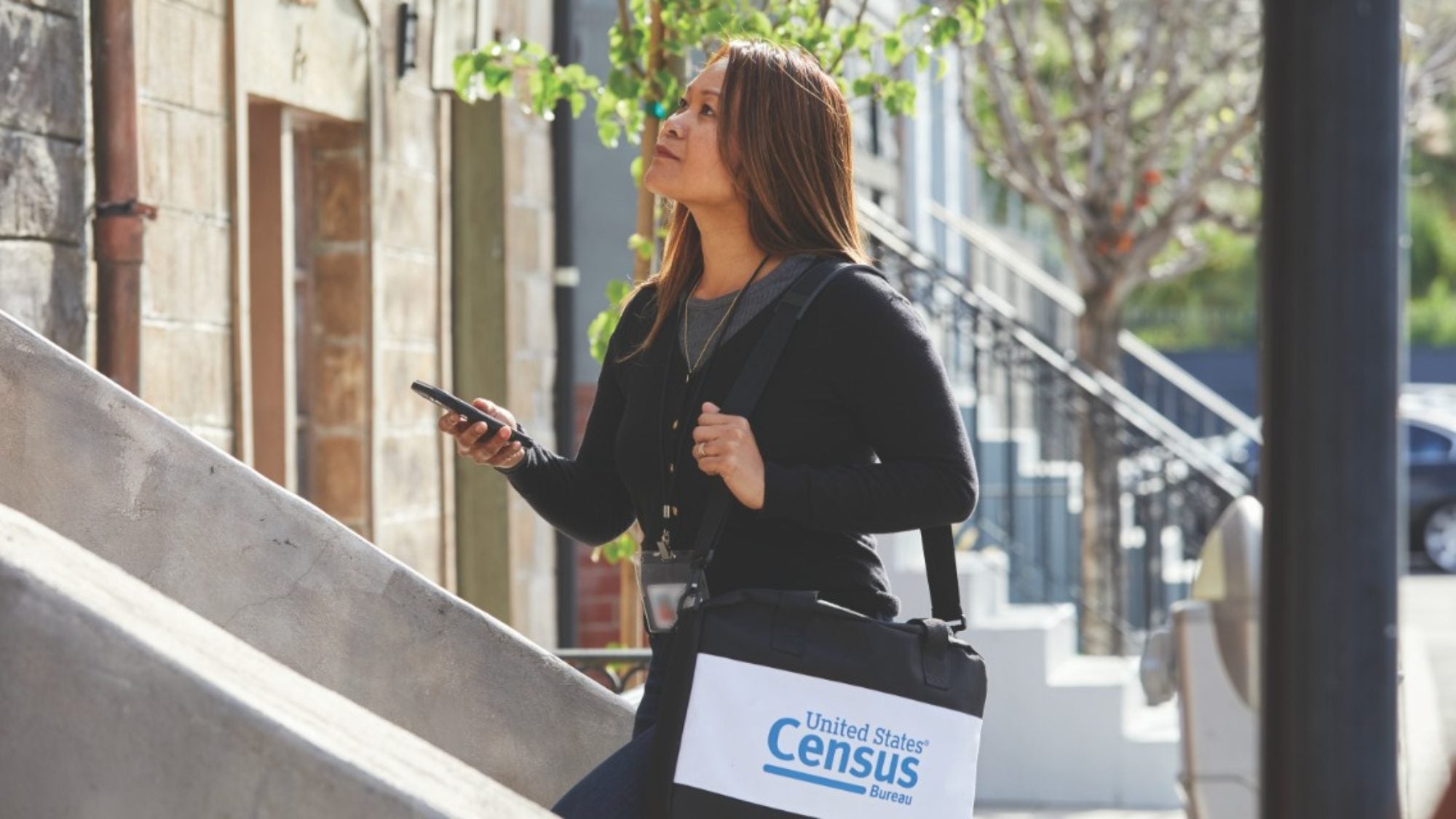 Census worker walking upstairs