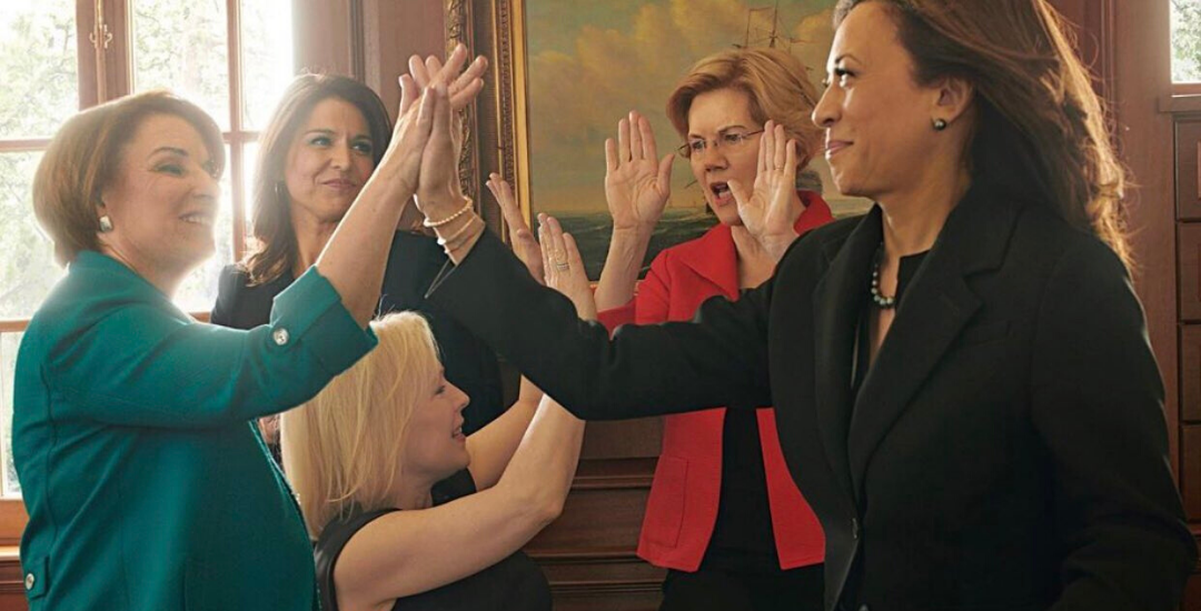 Female political leaders giving each other high-fives