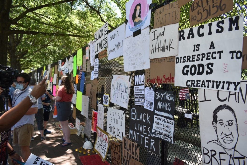 posters posted on a fence