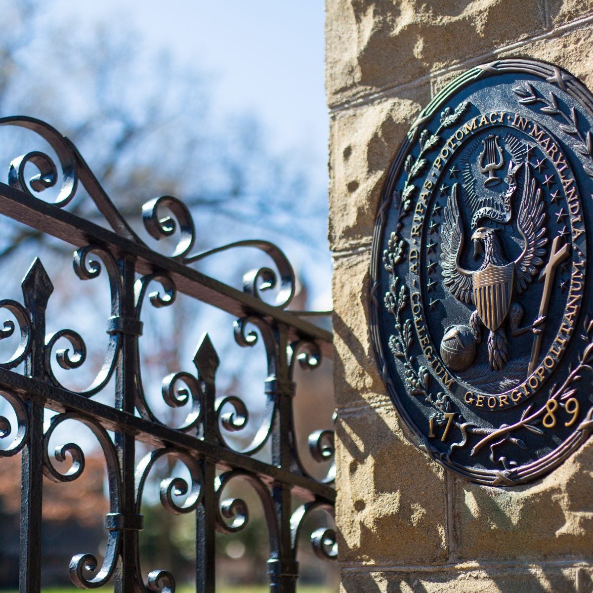 Georgetown front gates with university seal in the foreground