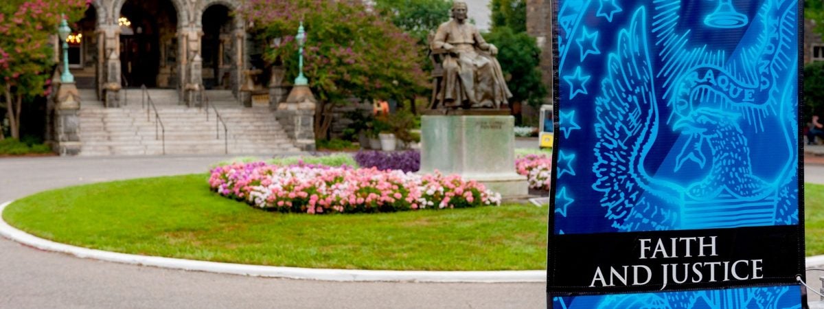 Sign on main campus representing faith and justice