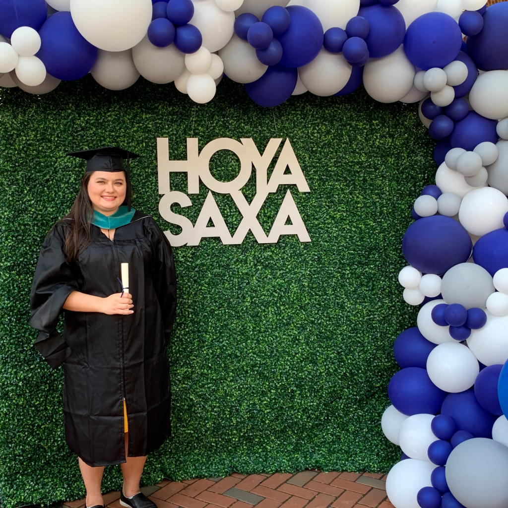 Headshot of Nicole Dan in Graduation regalia