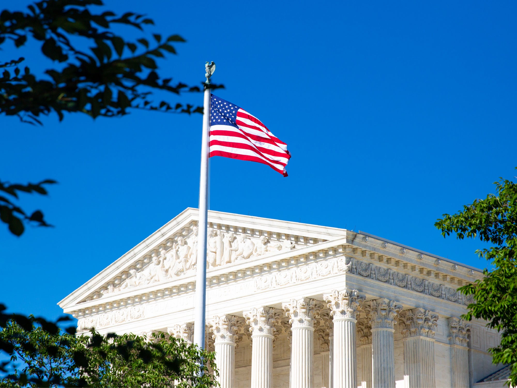 Image of DC government building with flag in the forefront
