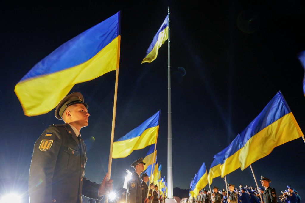 Ukrainian soldier holding the Ukraine flag