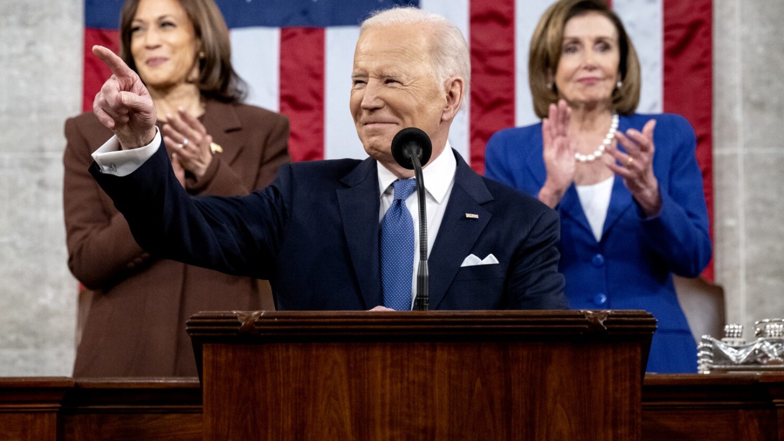 President Biden giving his State of the Union Address, flanked by VP Harris and Speaker Pelosi