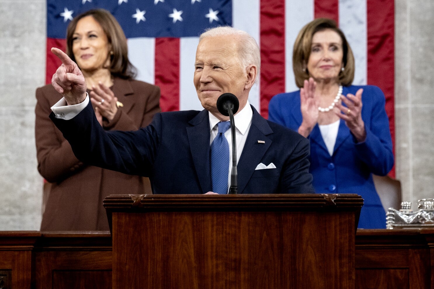 President Biden giving his State of the Union Address, flanked by VP Harris and Speaker Pelosi