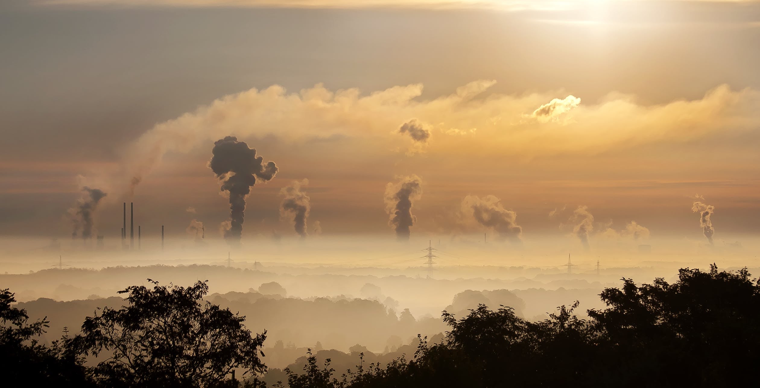 Industrial site air pollution at sunrise