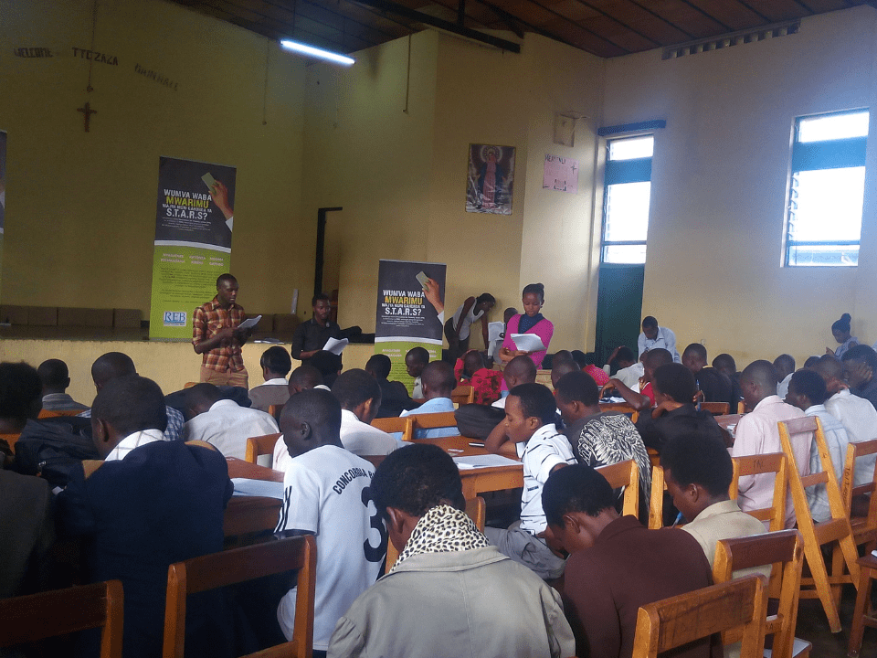 A Rwandan teacher leads a primary school class