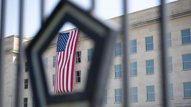 An American flag, unfurled at dawn, hangs over the Pentagon on the anniversary of the 9/11 attacks, Washington, DC, Sept. 11, 2019. (DoD photo by Lisa Ferdinando)