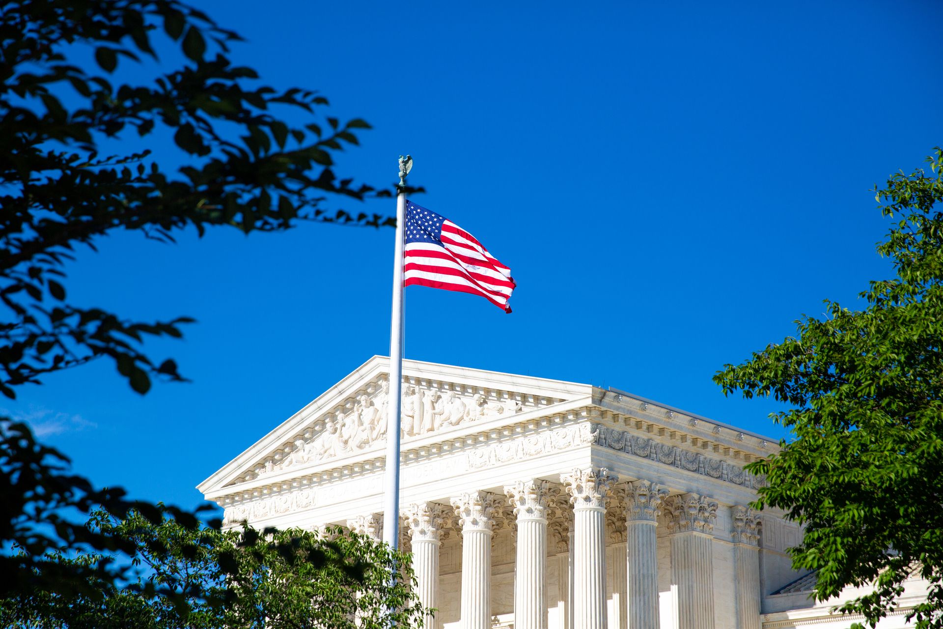 Supreme Court and an American flag in front