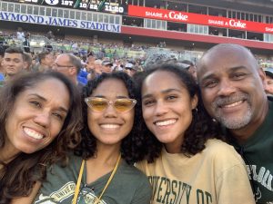 Natalia Cooper and her family, Gina Ann Mensack (far left), Lexie Hall (left) and Sean Cooper (right), at a University of South Florida football game in 2019. Meescha Cooper and Steven Mensack not present.