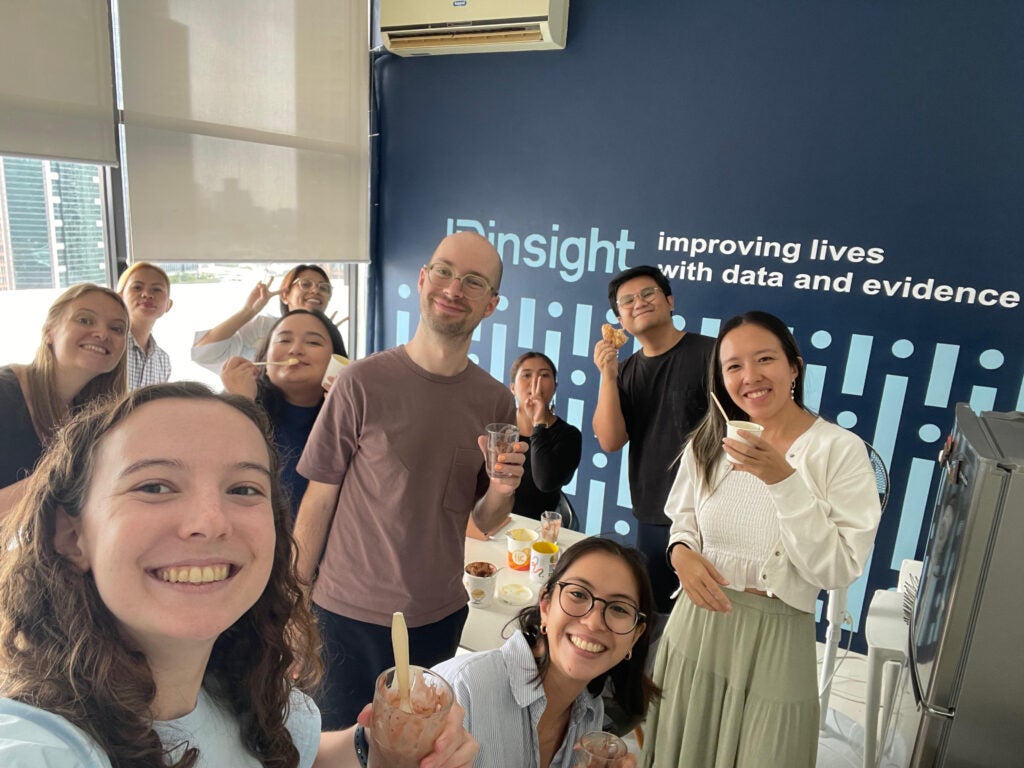 Hannah Reynolds (MIDP'25) (far left) participated in an ice cream social with IDinsight coworkers to commemorate the end of a major project.