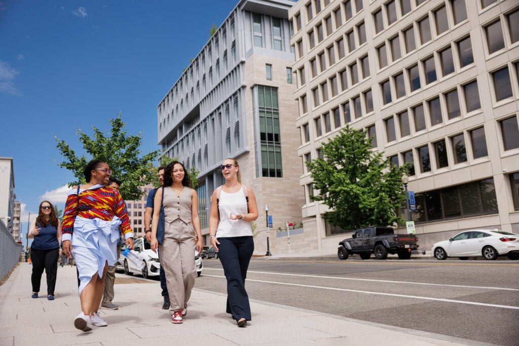 Group of students walking down street in DC.