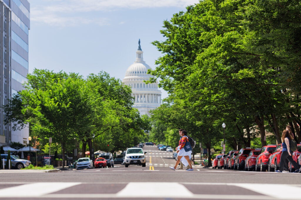 Students walking in front of the Capitol