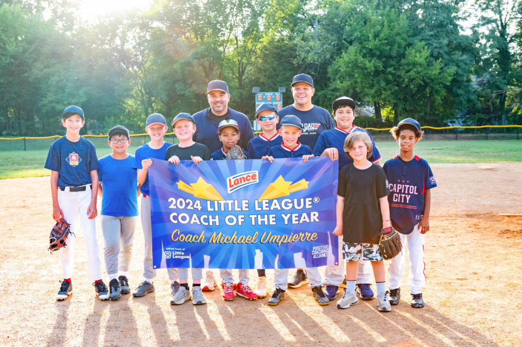 Little League Coach of the Year Michael Umpierre with his team