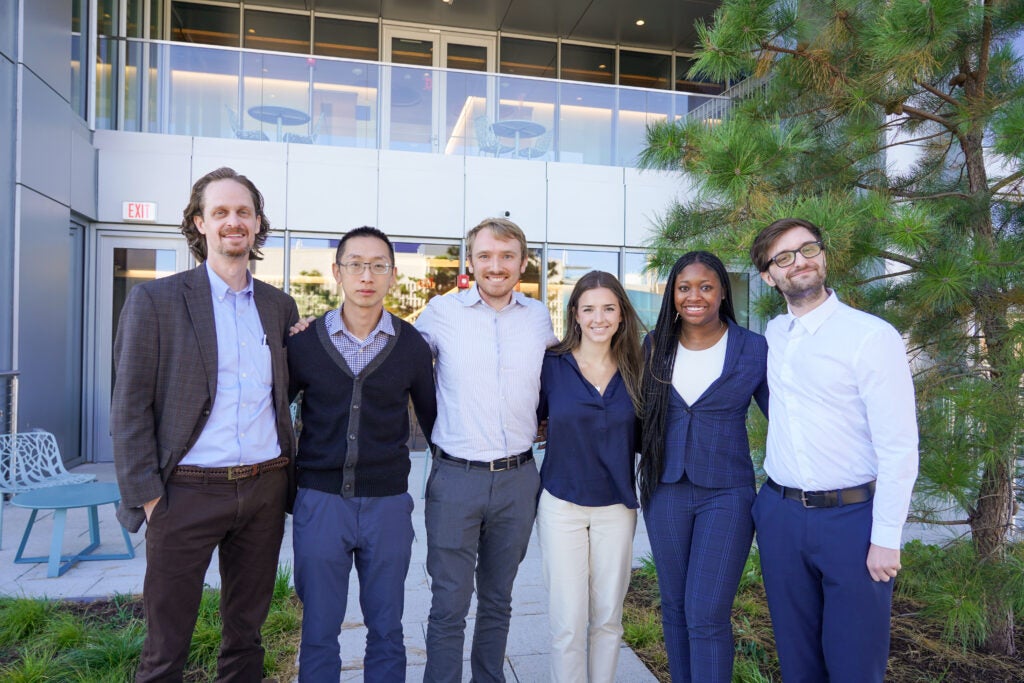 Newmark Scholars standing in front of McCourt building.