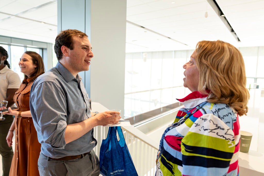 Alumni engage in conversation at a McCourt event 