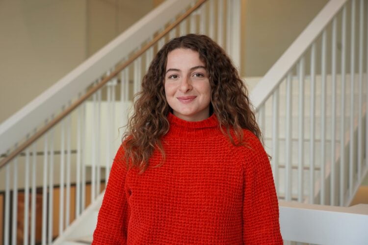 Headshot of Patricia Samman wearing red sweater