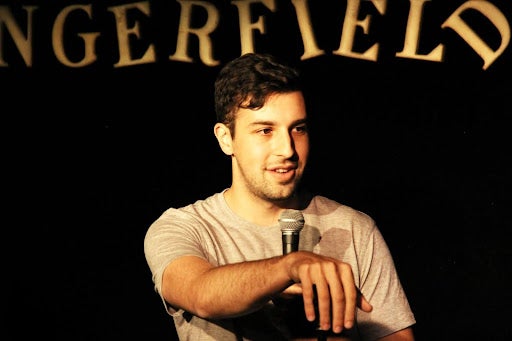 Matt Steinberg (MPP'26) performing stand-up comedy.