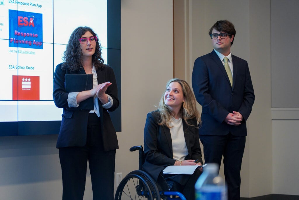 (Left to right) Demi Tomasides (MPP’26), Nina Bachich (MPP’26) and Ethan Bose (MPP’26) present their proposal, A.C.C.E.S.S. - D.C., at the 2025 Georgetown Public Policy Challenge.