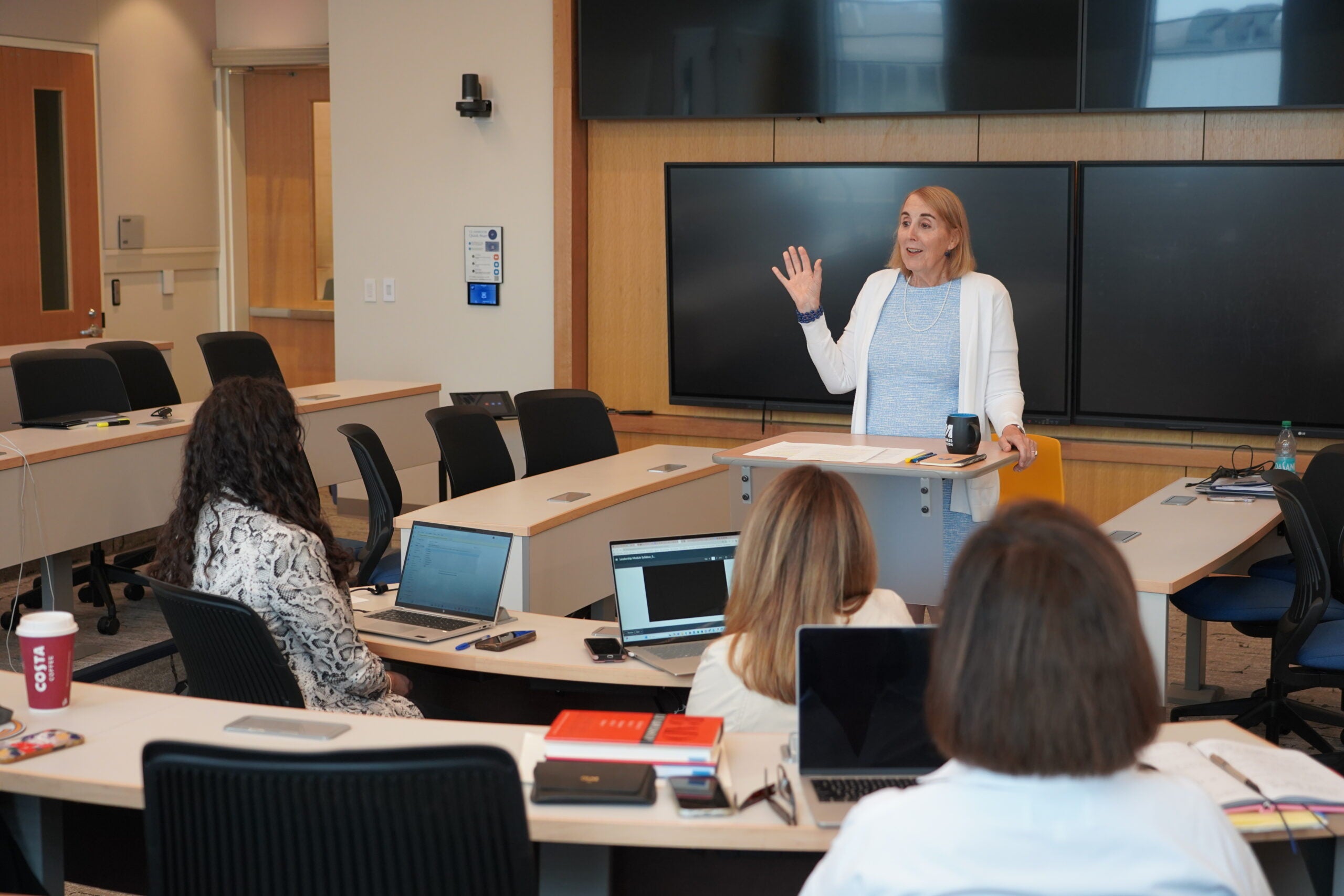 Chloe Schwenke, EMPL faculty director, teaches students in the executive master’s program
