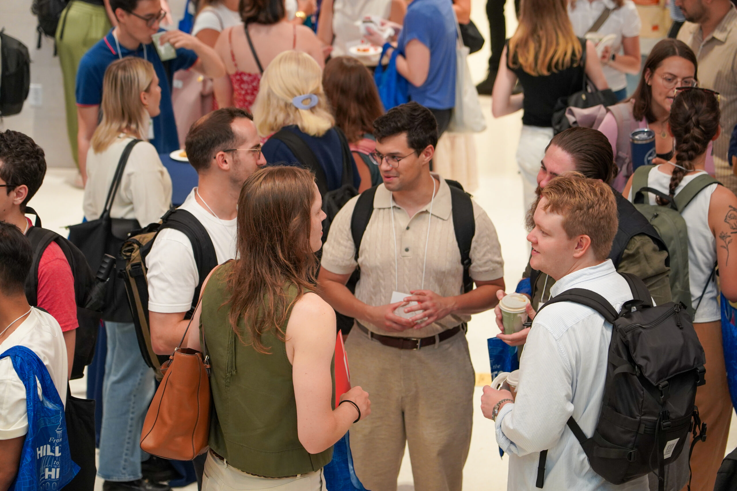 Students standing and talking on McCourt's 2nd Floor Common Area