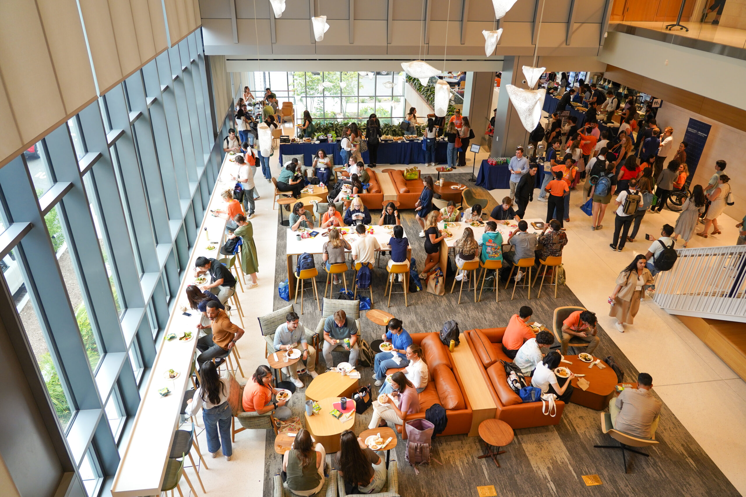 Aerial view of McCourt's 2nd-Floor Common filled with students eating meal