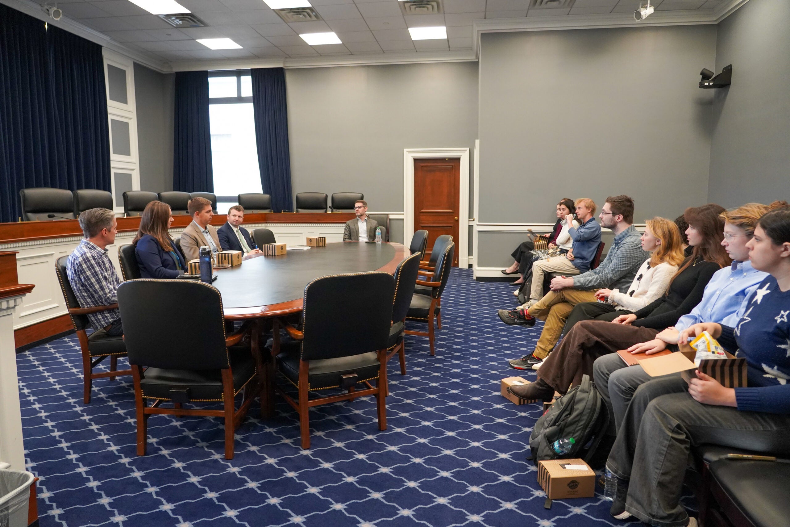 JPPP students sitting in a room at the U.S. House of Representatives listening to a panel of congressional staff
