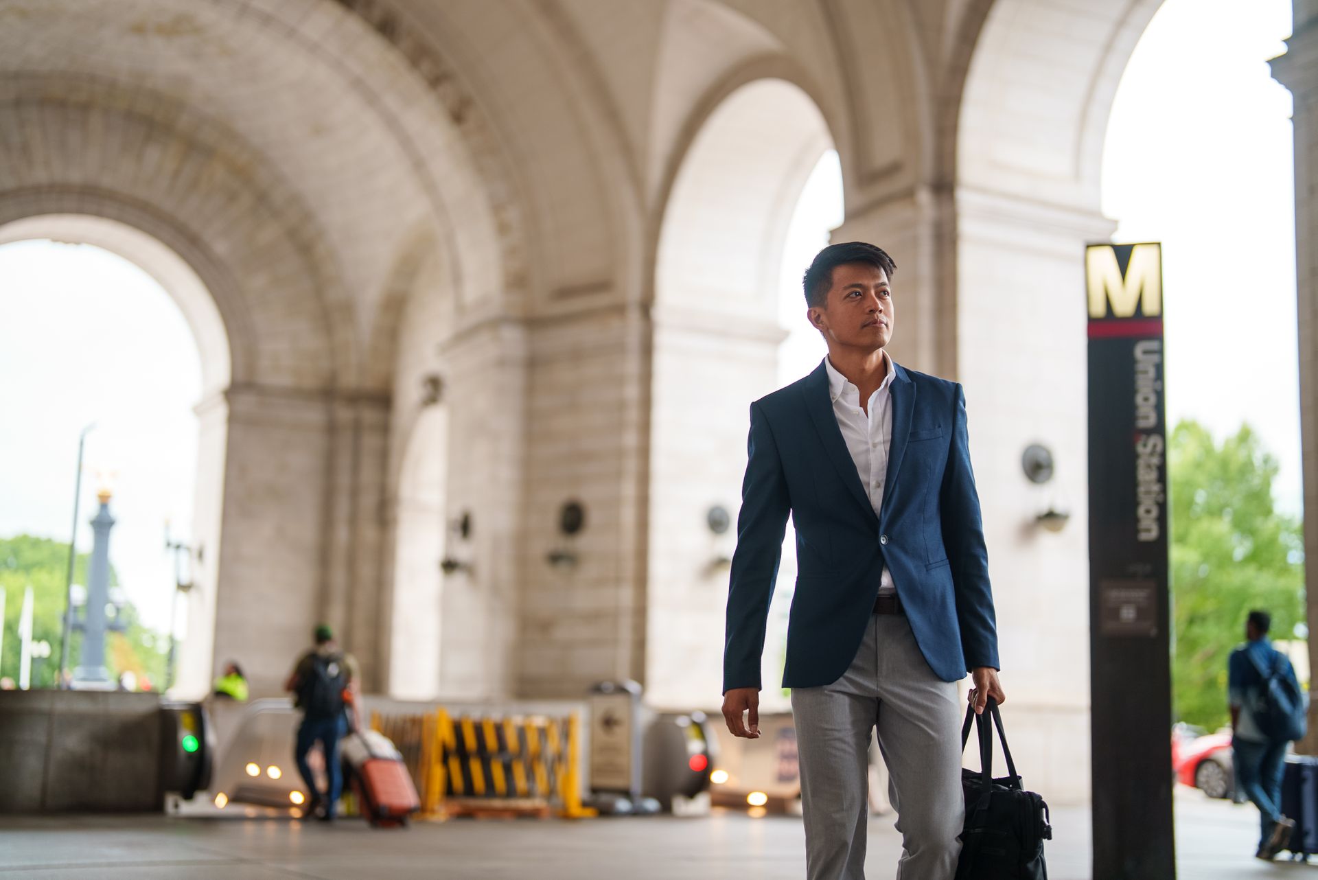 A student exiting the metro station on the way to work.