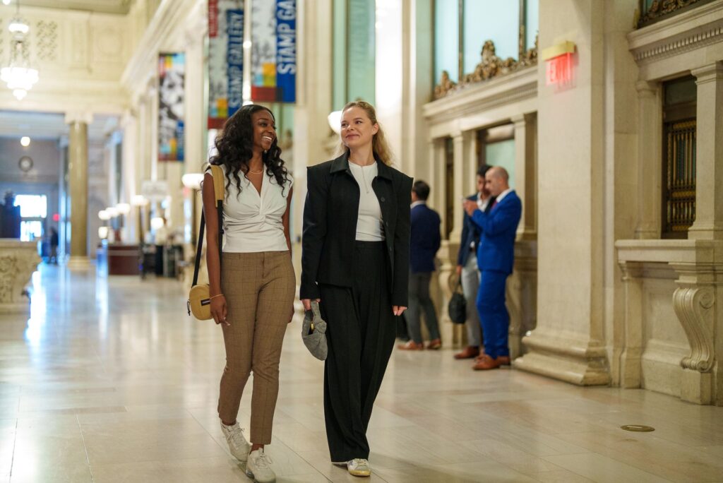Two students walking together in Union Station in Washington, DC.
