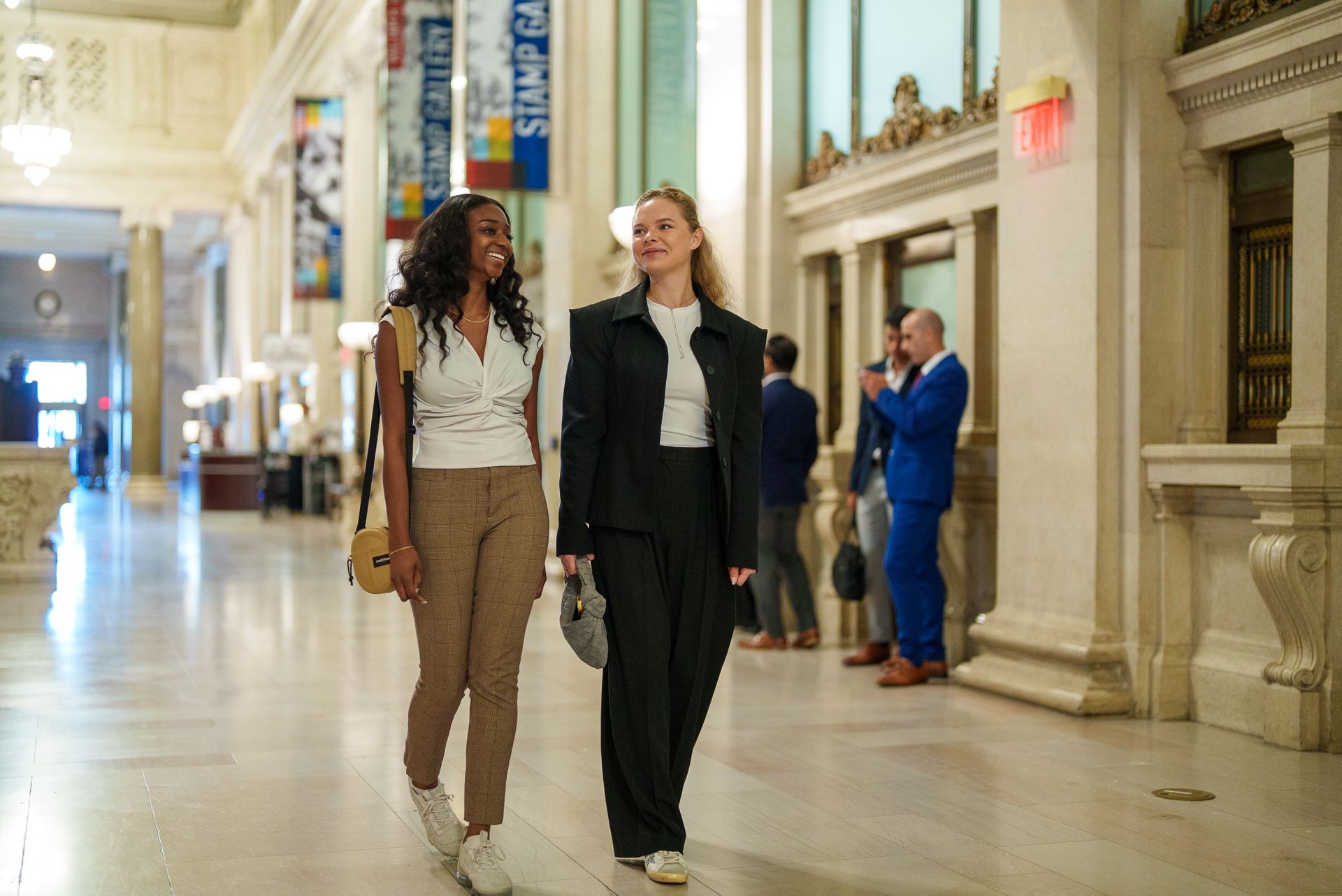 Two students walking together in Union Station in Washington, DC.