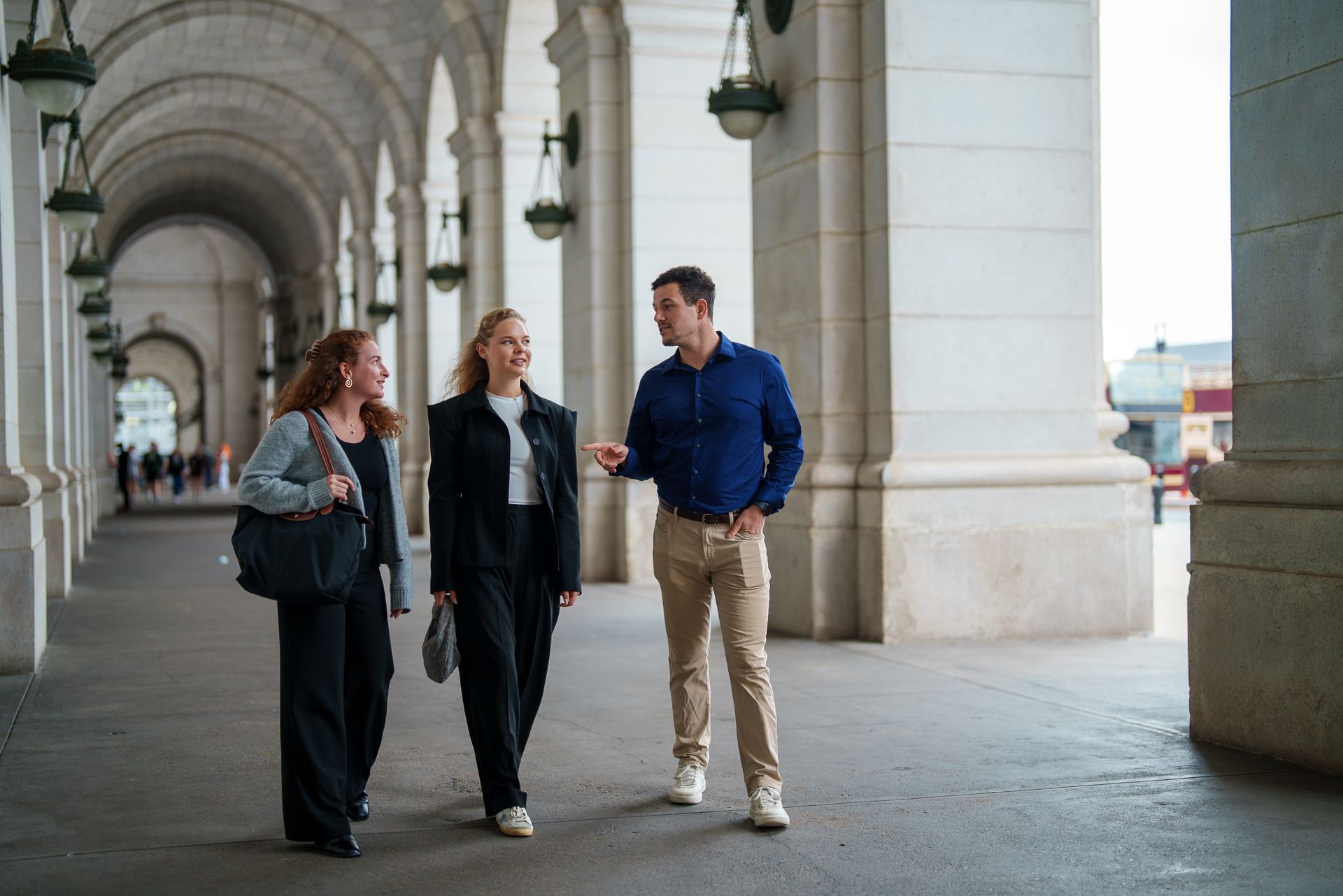 Three students walking together outside of Union Station in Washington, DC.