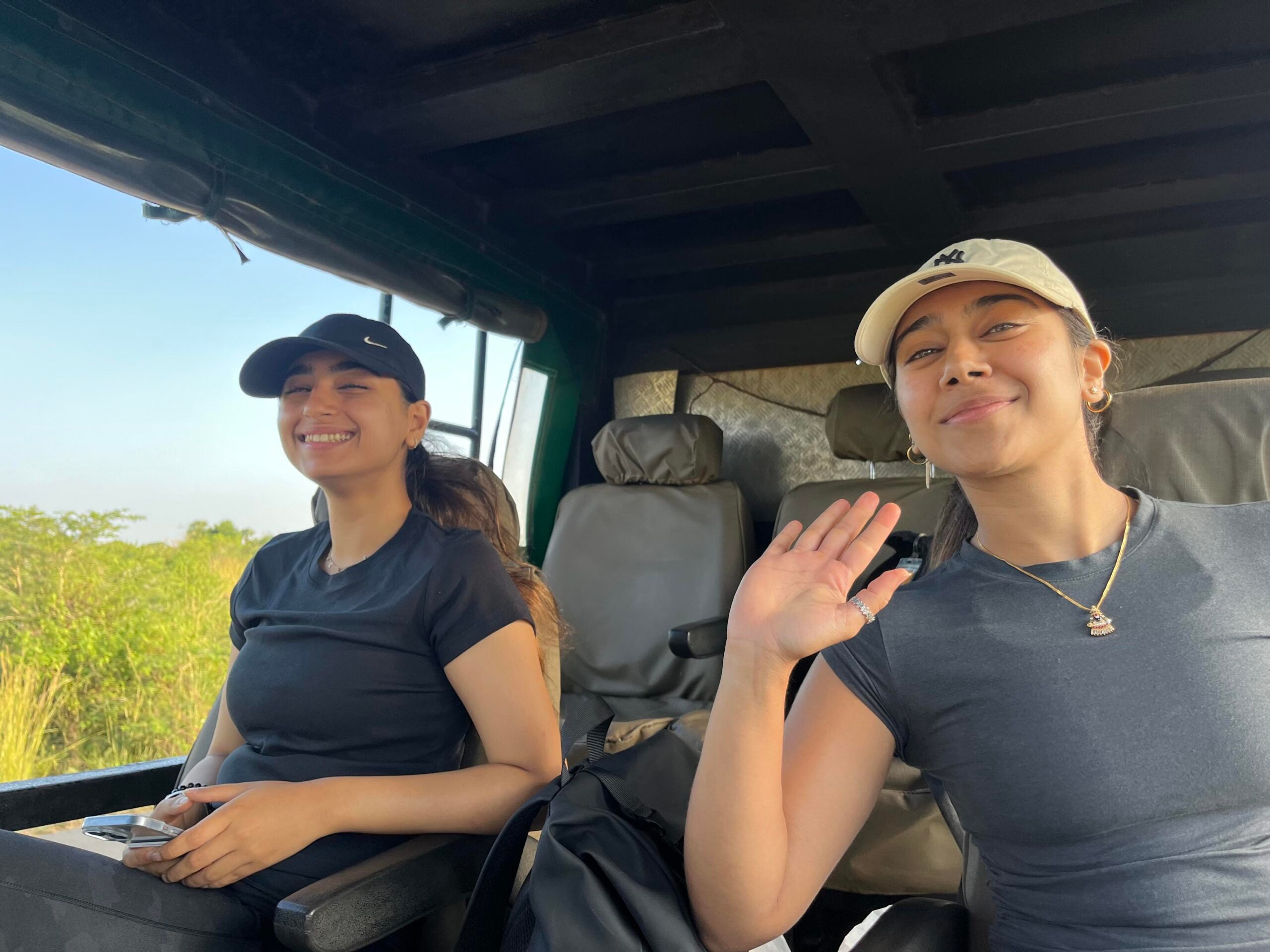 Two students riding in a car.