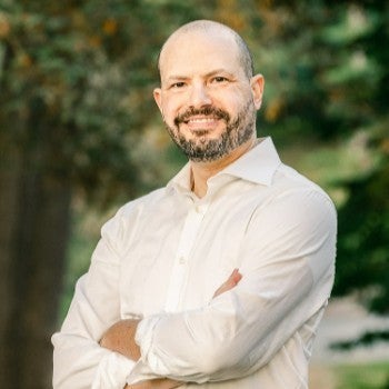 Philip Steigman outside with arms crossed