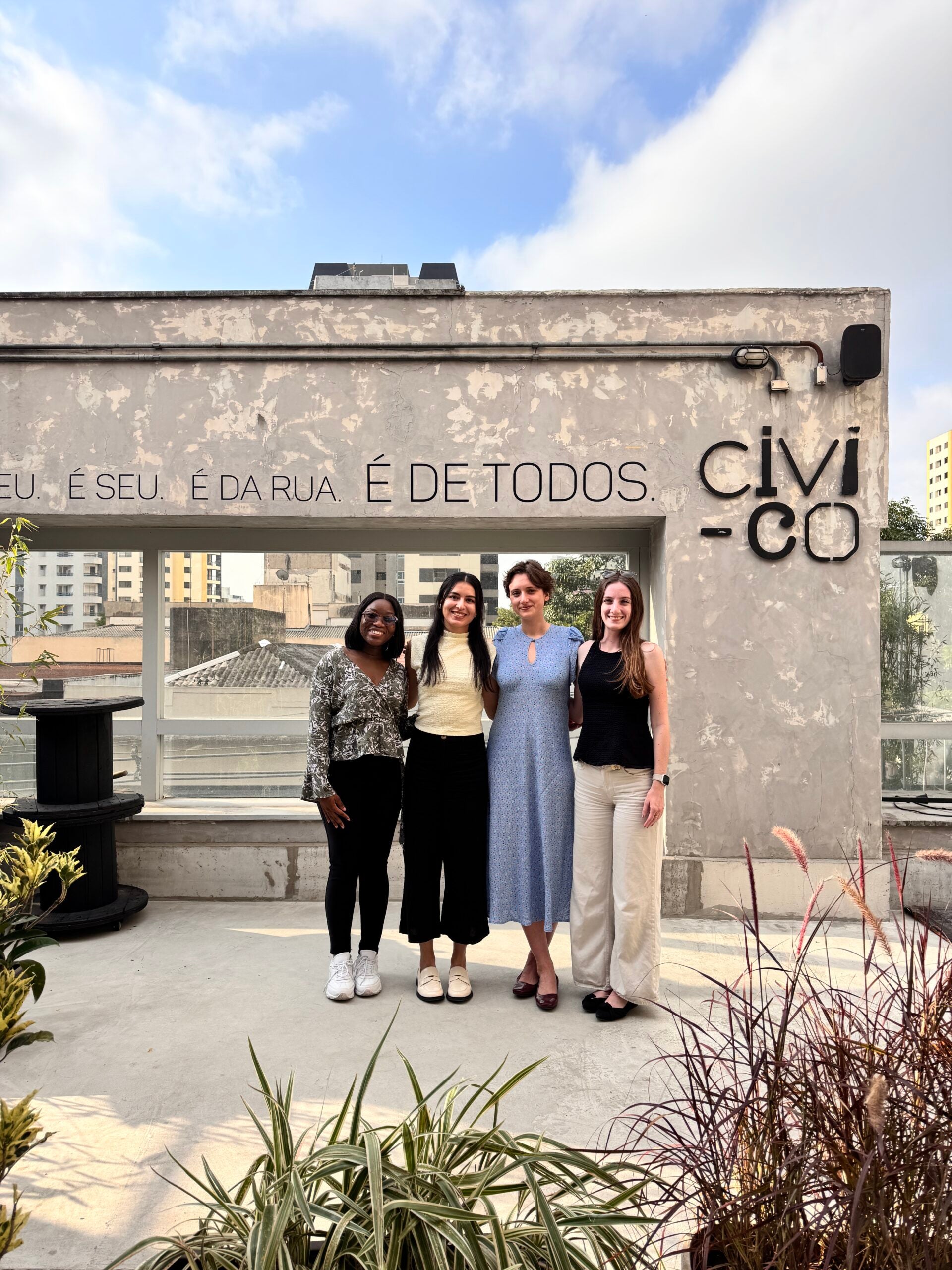 Four people standing in front of Brazilian government building