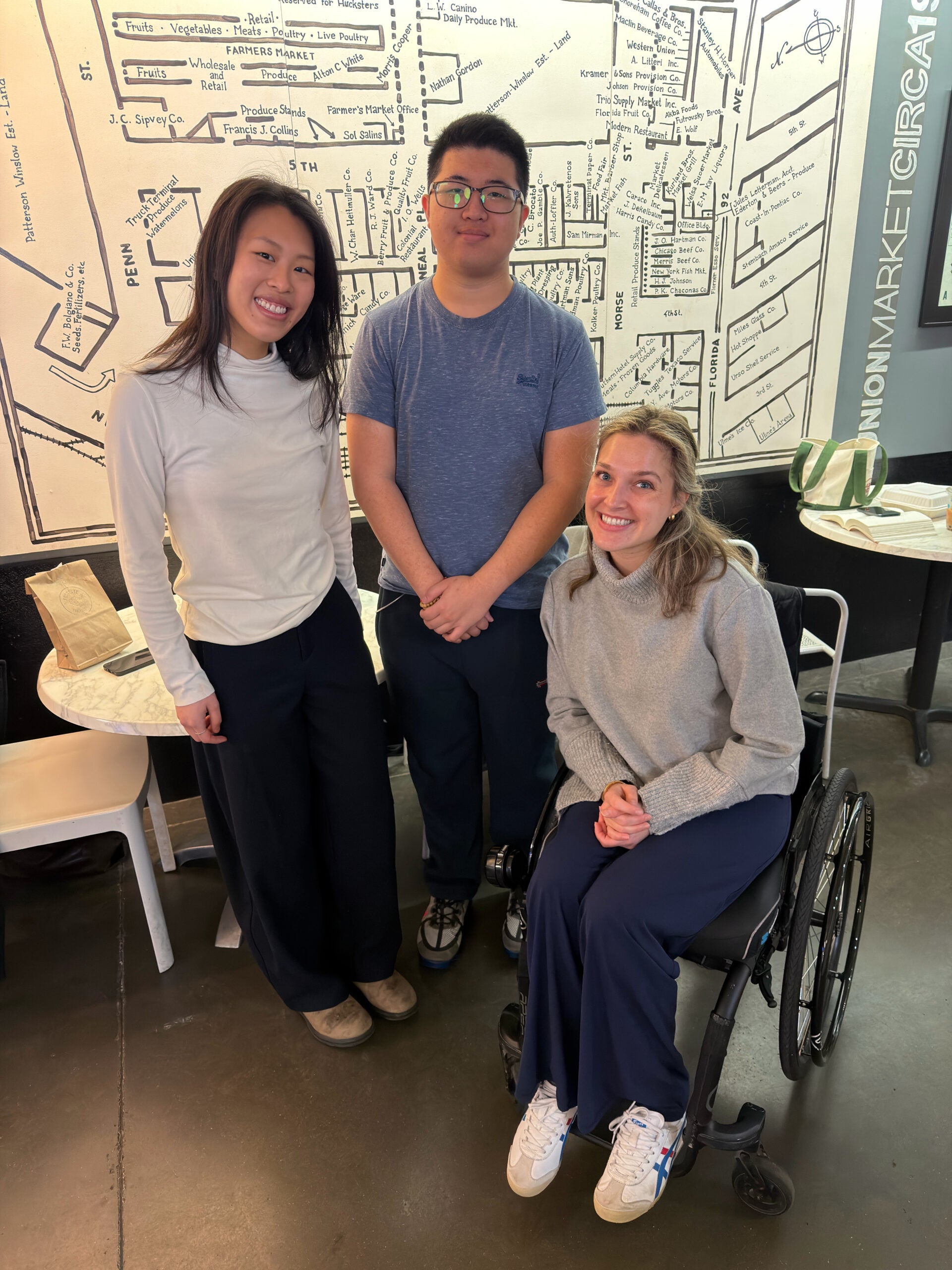 Three McCourt graduate students posed together.