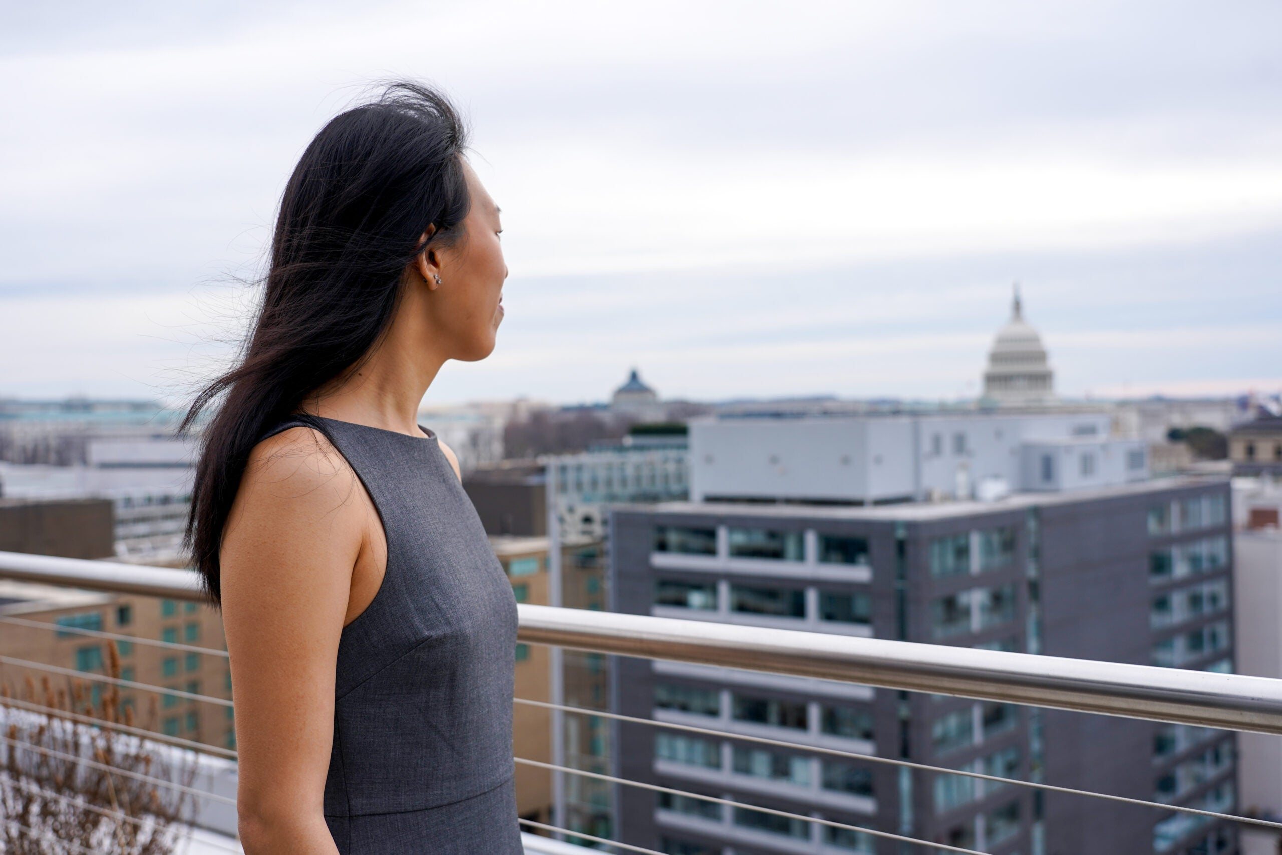 Britney Cheung (MPP'26) stands outside looking at the US Capitol in the distance
