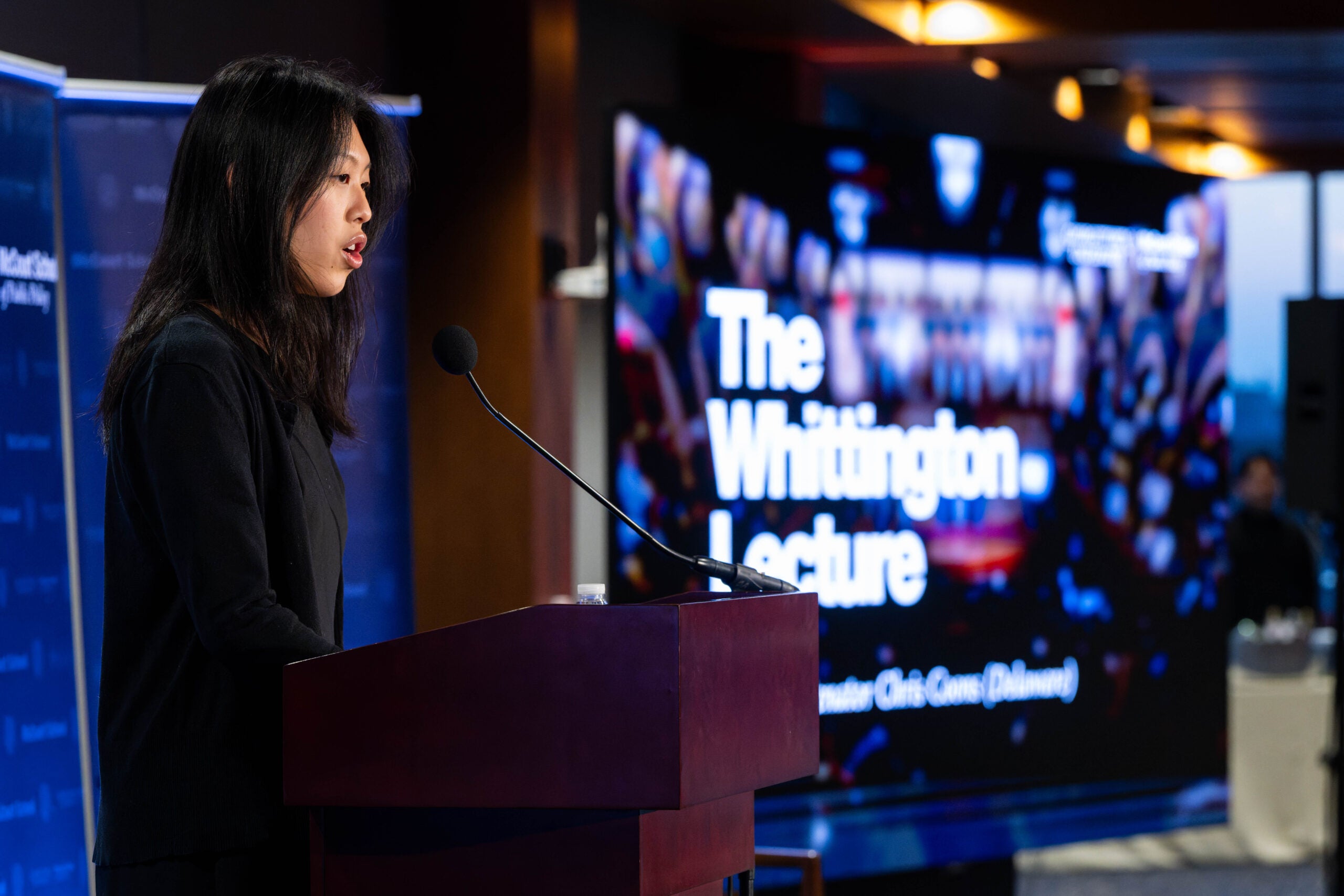 Britney Cheung, Whittington Scholar, introducing Senator Coons.