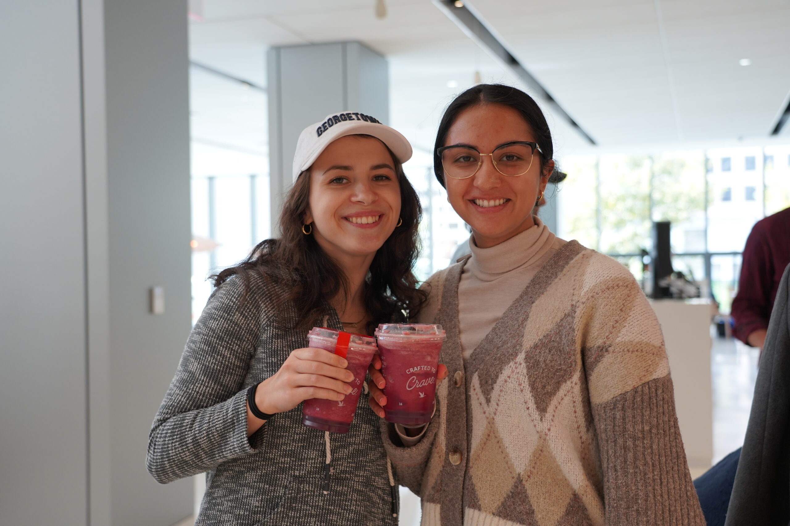 Two students posing with fresh smoothies