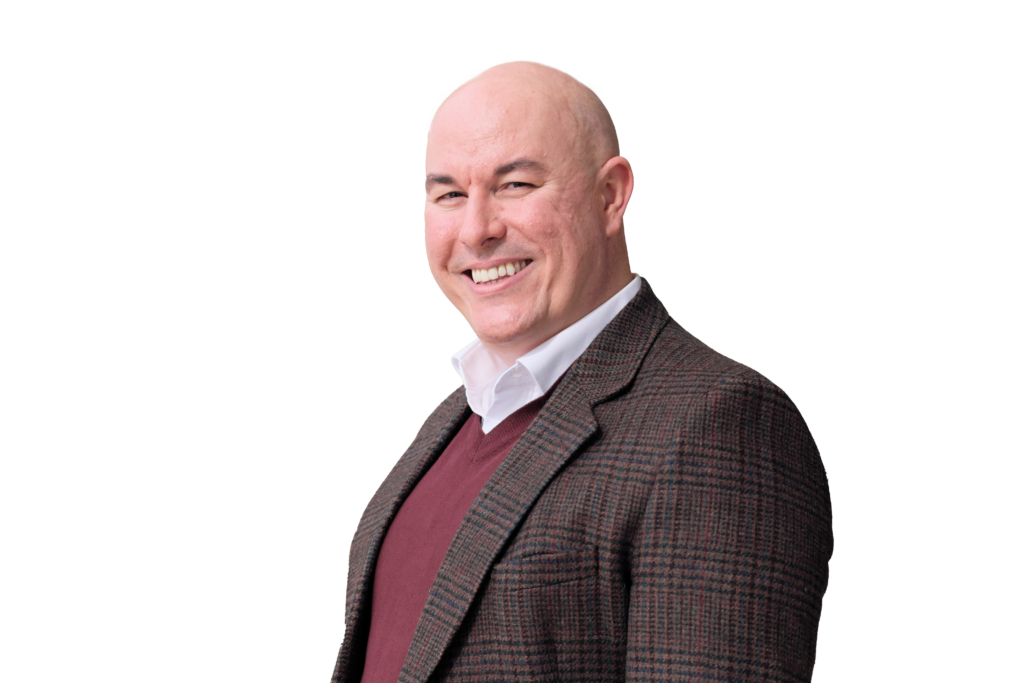 Professional headshot of Jason McKnight, white background
