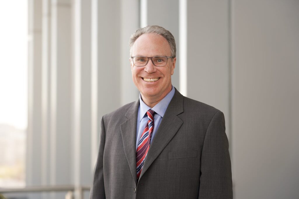 Professional headshot of Tom DeLeire