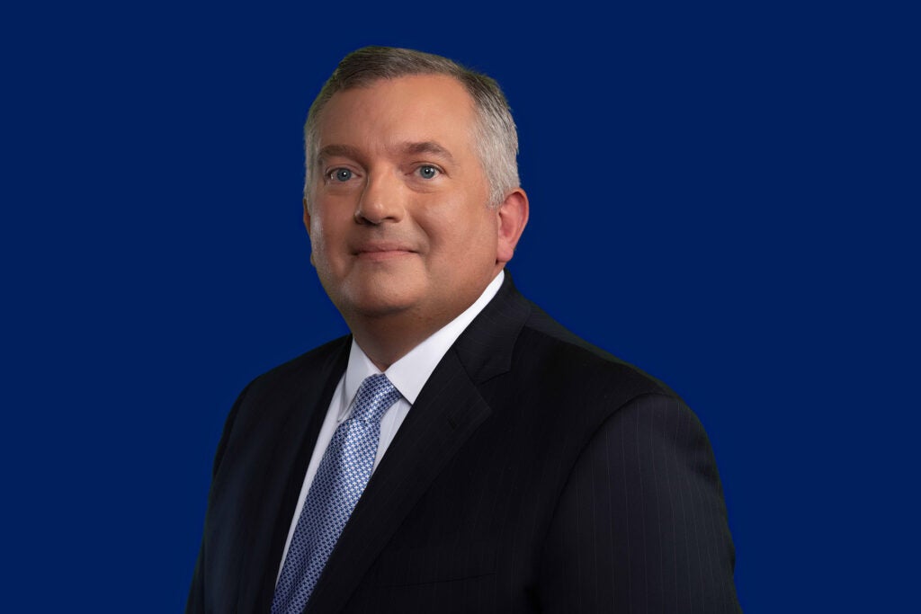 Professional headshot of Neil Bradley