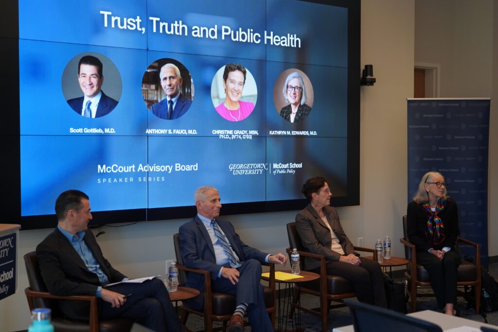 A panel of four people speaking on trust, truth and public health