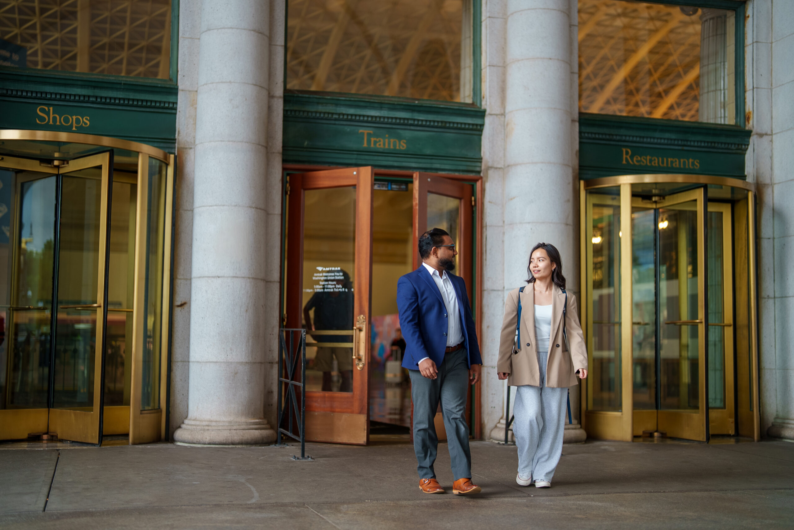 Two people walking out of Union Station