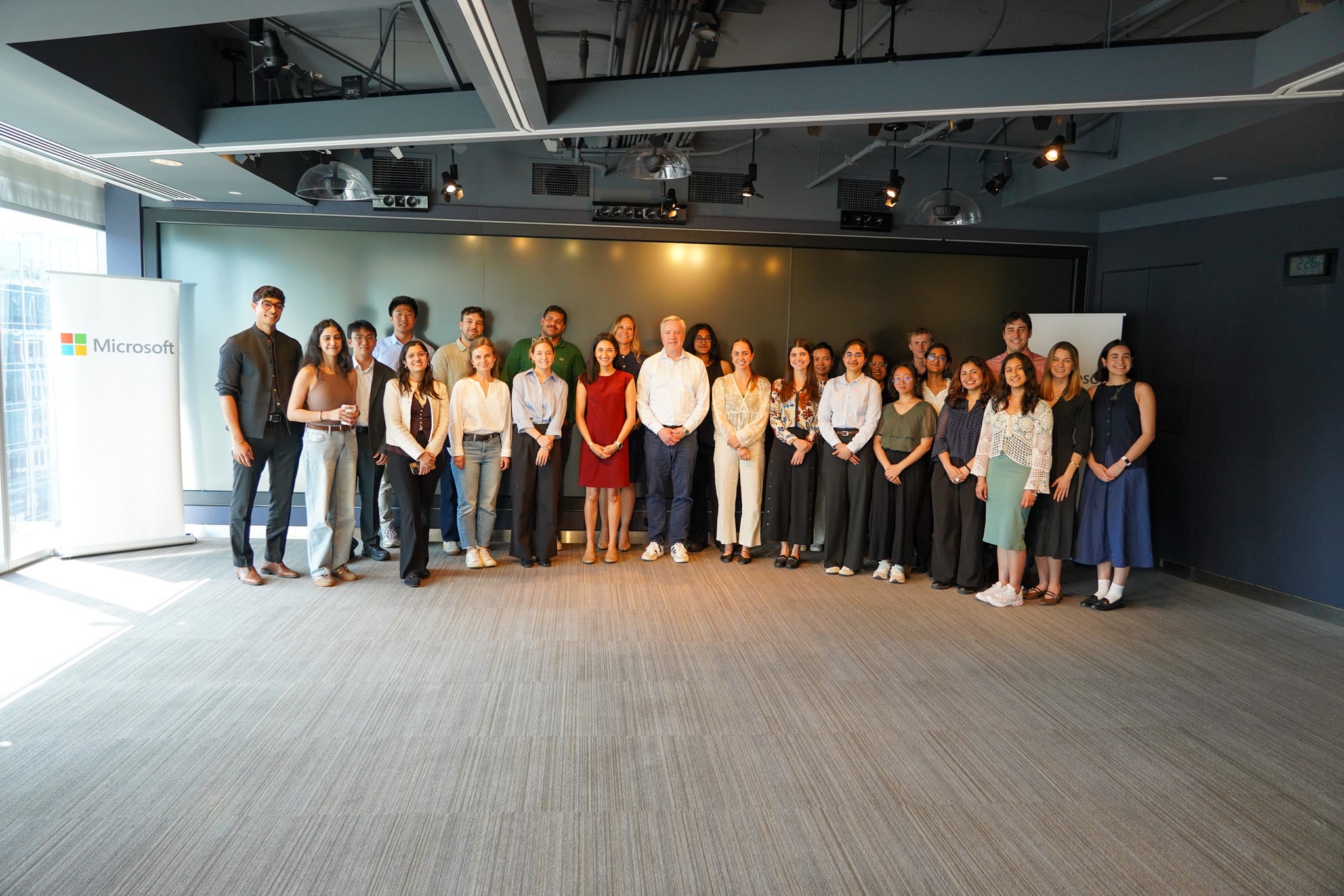 Large group of people standing next to eachother