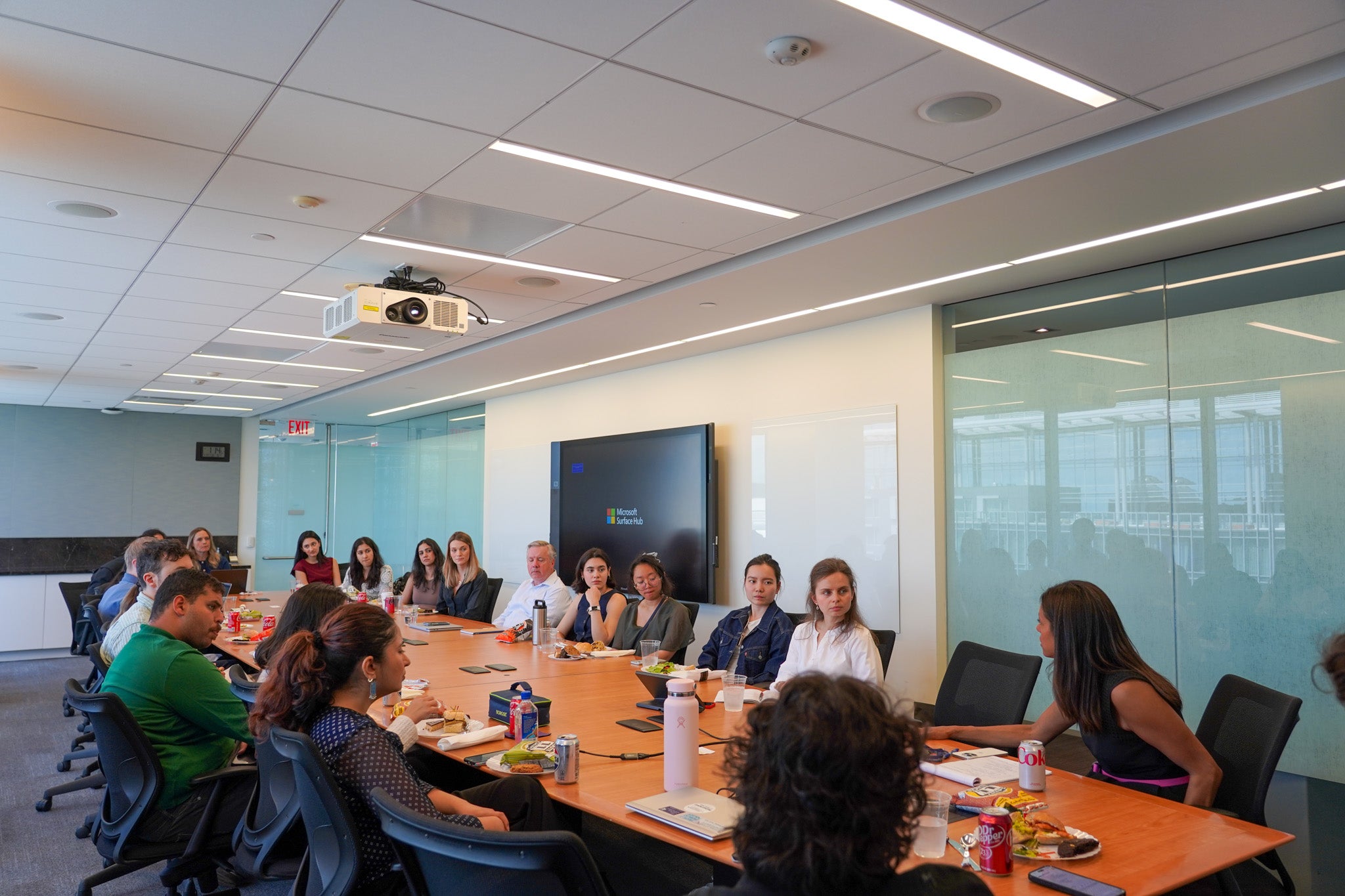 Large group of people sitting at conference table