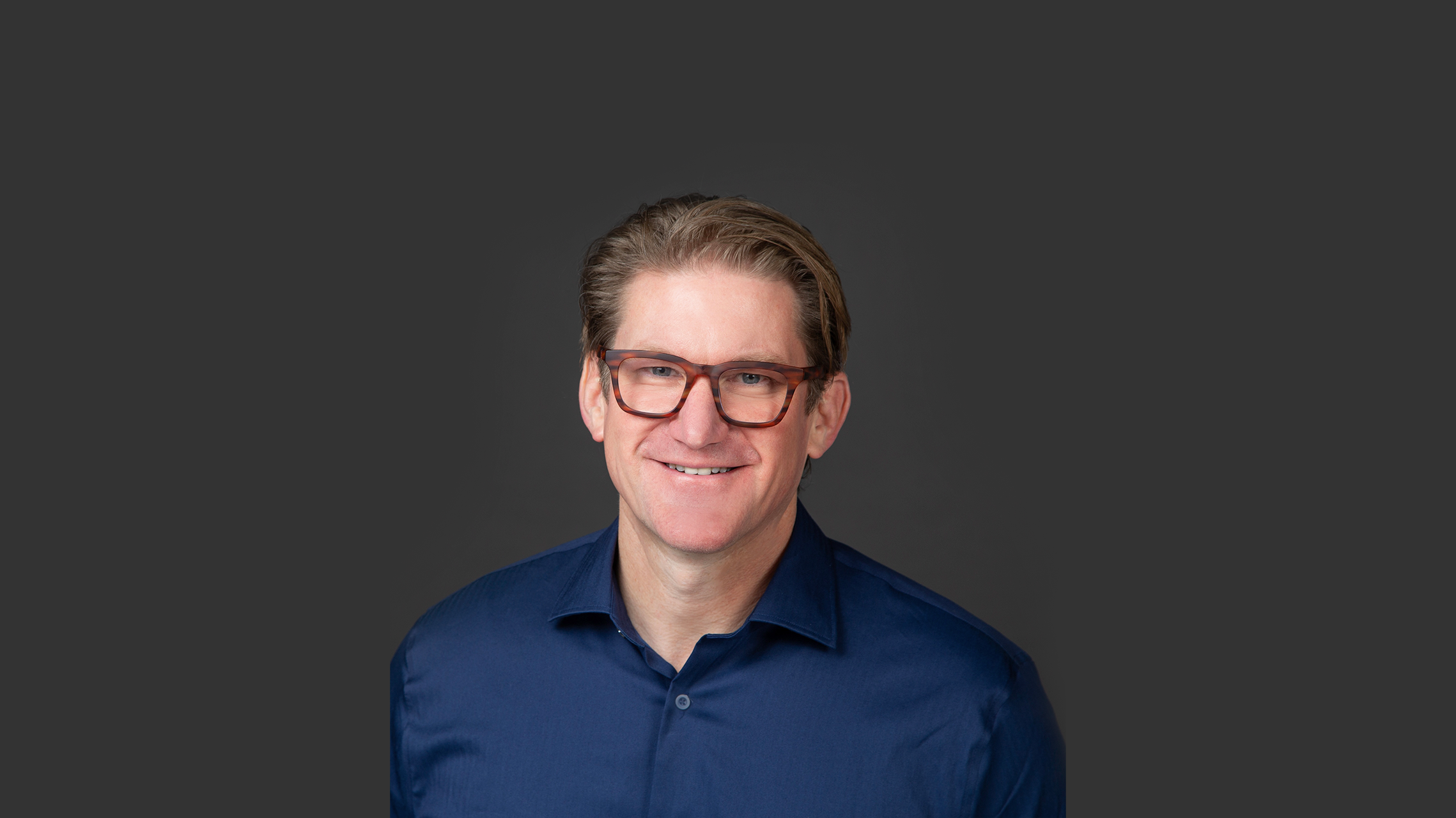 Wade Swenson against a dark grey background