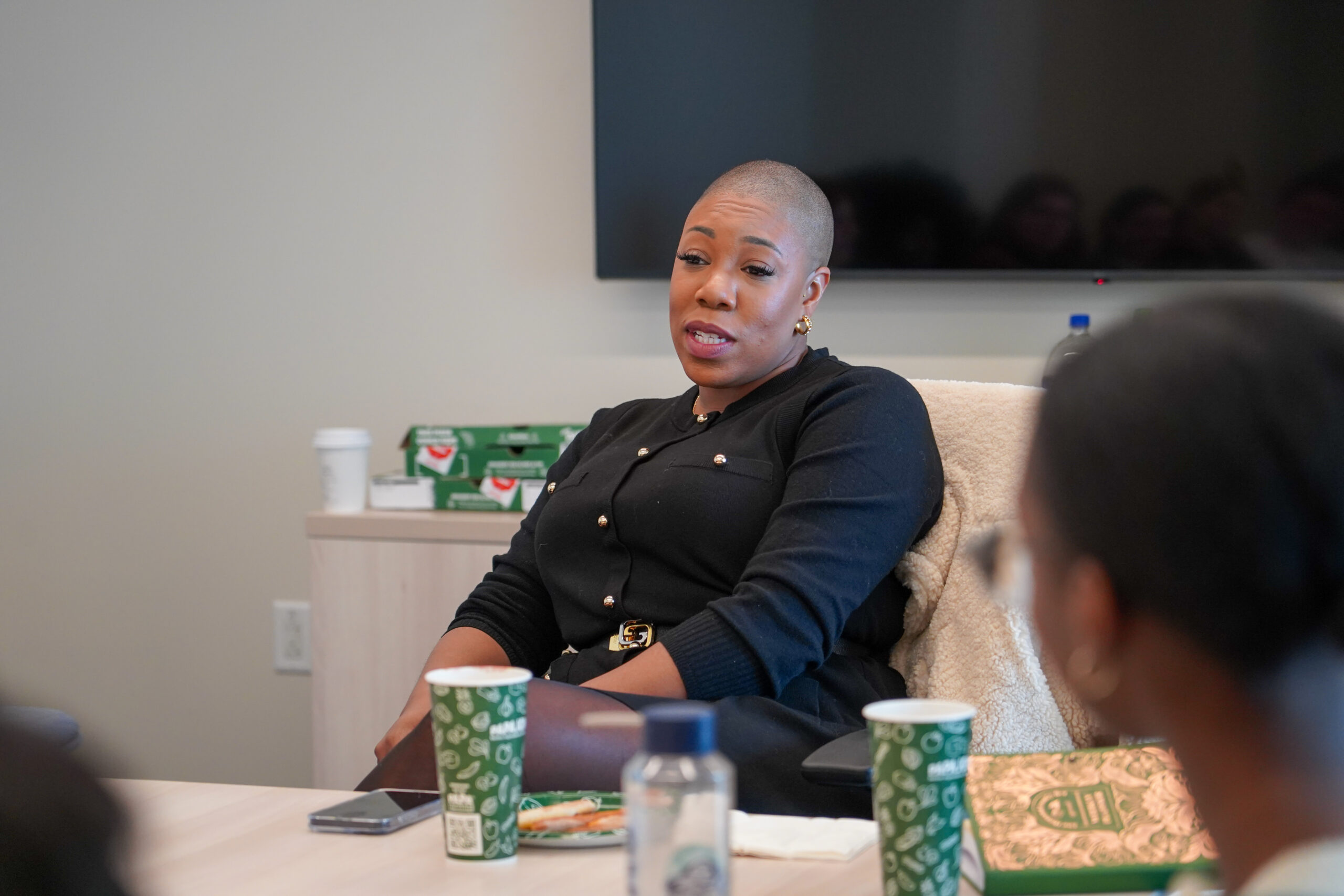 GU Politics Fellow Symone Sanders leads discussion from head of table