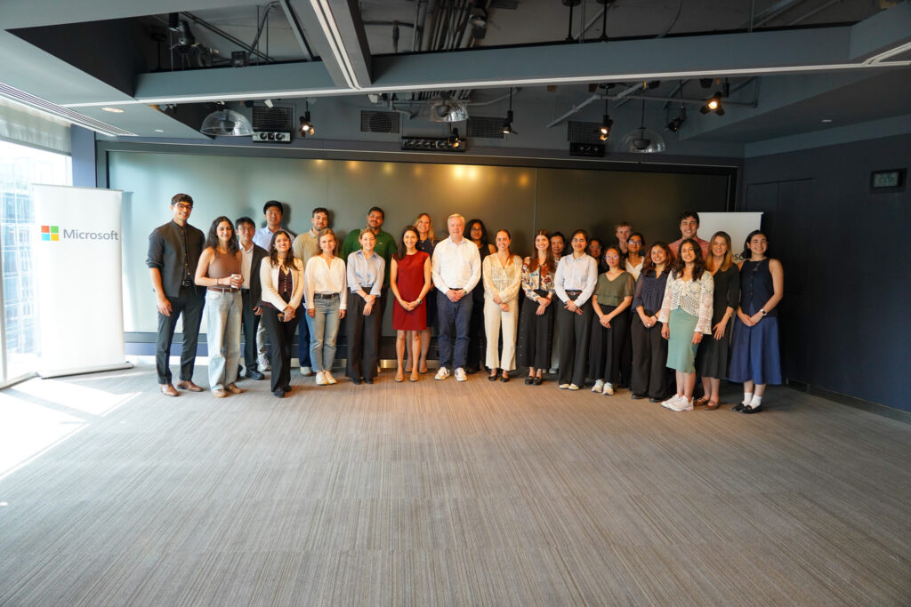 Large group of people standing next to eachother